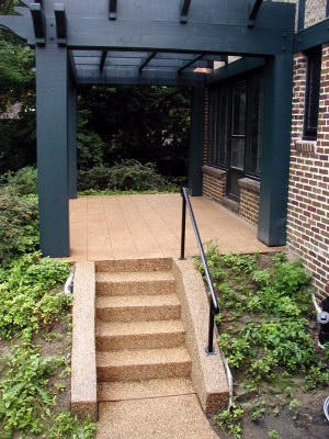 New stairs in exposed aggregate blend with existing terrace.