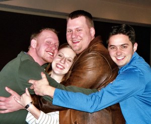 Tom helps brothers Eric and Kevin put their squeeze on sister Sarah. 