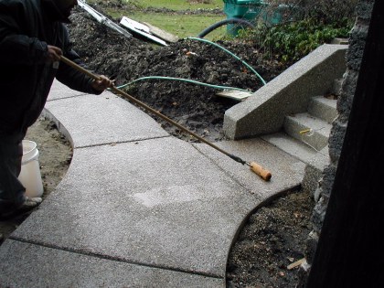 Sealer is applied to washed aggregate walkway