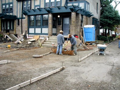 Forms and wire being placed for pouring driveway