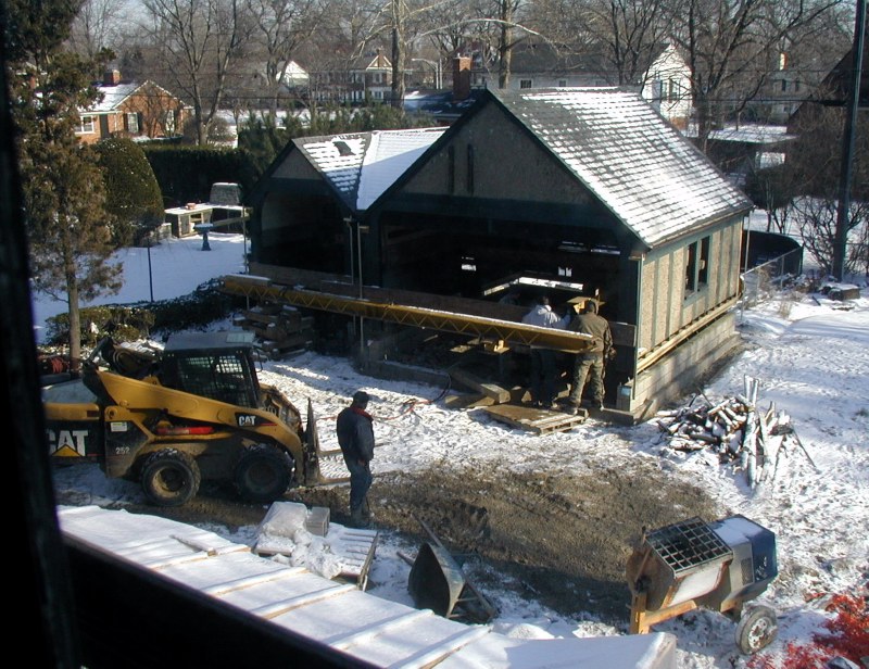 D and B House Movers prepares to lower garage onto foundation and new block walls. January 23, 2008